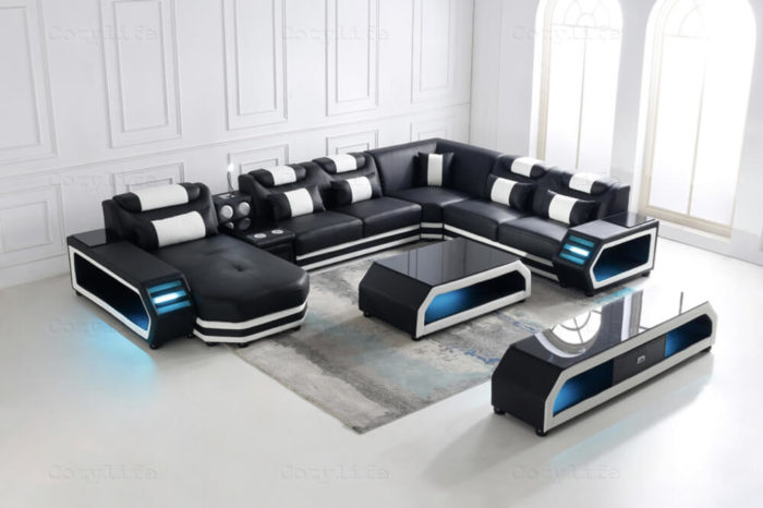large black sectional sofa with bluetooth speakers